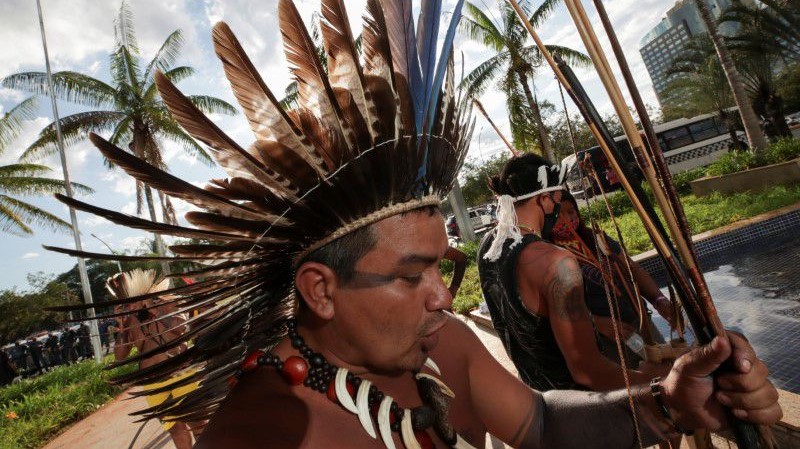 Firing arrows, indigenous people in Brazil protest bill curtailing land rights